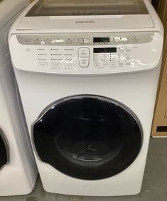 a white washer and dryer sitting next to each other