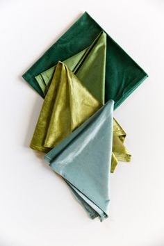 three folded napkins sitting on top of each other