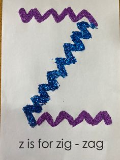 a piece of paper with purple and blue writing on it that says z is for zig - zag