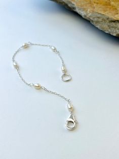 Handmade Freshwater Pearl Bracelet, White Bracelet, Sterling Silver Bracelet, Wedding Bracelet, Minimalist Bracelet, Dainty Bracelet, - Etsy Minimalist Silver Pearl Bracelet With Adjustable Chain, Minimalist Adjustable Pearl Bracelet With Extender, Minimalist Pearl Bracelet With Extender, Adjustable White Bracelet With Sterling Silver Clasp, Adjustable White Chain Bracelet With Lobster Clasp, Delicate Adjustable Bracelets With Lobster Clasp, Delicate Adjustable Chain Bracelet With Lobster Clasp, Adjustable Dainty Bracelet With Sterling Silver Clasp, Dainty Adjustable Bracelet With Lobster Clasp