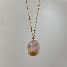 🌈Colorful Baroque Pearl Necklace 🌈 This Baroque Pearl Pendant Necklace features a handpicked, one-of-a-kind natural baroque pearl with a colorful orange-pink lustre, suspended from a waterproof stainless steel chain. *This is a handpicked, one-of-a-kind baroque pearl pendant, you will receive the exact necklace in the picture. :) * MATERIALS: Natural Baroque Pearl, Stainless Steel FINISHING: 18K Gold-Plated LENGTH: Around 48-49cm (non-adjustable) PENDANT DIMENSION: Approx. 22x17mm *Natural mat Multicolor Jewelry With Pearl Charm As Gift, Multicolor Jewelry With Pearl Charm For Gift, Multicolor Pearl Charm Jewelry As Gift, Multicolor Pearl Charm Jewelry Gift, Multicolor Necklaces With Pearl Charm As Gift, Multicolor Pearl Chain Jewelry For Gift, Multicolor Pearl Charm Necklace For Gifts, Multicolor Pearl Drop Jewelry As Gift, Handmade Teardrop Pearl Necklace Gift