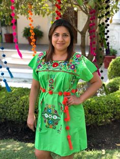 We know that there is not a complete mexican party without the perfect outfit This mexican embroidered dress is perfect for your bohemian look. You will love your New Mexican dress perfect for your summer look or any fiesta  Measurements:  35" inches length x 18" inches shoulder to shoulder  Size: one size fits all This listing is for 1 GREEN mexican dress All orders are shipped using Mexican Postal Service and it takes: 15-25 business days (North America). 20-30 business days (Europe). 20-35 business days (Rest of the world).  If you are in a hurry or if you would like to use another shipping service, please contact me before placing your order. The extra cost is calculated according to the package dimension and weight. Green Dress With Embroidered Neckline For Spring, Spring Green Dresses With Embroidered Neckline, Spring Green Dress With Embroidered Neckline, Green Folk Style Dress For Festivals, Embroidered Dress For Fiesta And Festivals, Green Folk Dress For Summer, Green Folk Dress For Festivals, Green Folk Style Summer Dress, Bohemian Green Dress With Embroidered Hem