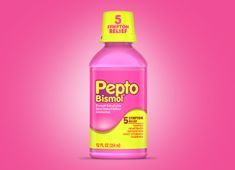 a bottle of pepto bisimol on a pink background