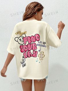 Embrace your inner qutie with our Summer Vibe Graffiti Tee. This vibrant and stylish tee will unleash your confidence and radiate positivity all summer long. Let your unique personality shine with every wear. Made from comfortable and durable materials, it's perfect for any summer adventure. Color : Beige Style : Casual Pattern Type : Cartoon Pattern Type : Slogan Neckline : Round Neck Sleeve Length : Half Sleeve Sleeve Type : Drop Shoulder Length : Long Fit Type : Oversized Fabric : Slight Stretch Material : Knitted Fabric Composition : 95% Cotton Composition : 5% Elastane Care Instructions : Machine wash, do not dry clean Sheer : No Size US Bicep Length Bust Cuff Length Shoulder Sleeve Length Waist Size XS 2 43.60 111.00 40.60 69.50 53.40 21.80 110.00 S 4 45.00 115.00 42.00 70.50 55.00 2 Summer Graffiti Print Crew Neck Top, Summer Crew Neck Top With Graffiti Print, Casual Summer T-shirt With Graffiti Print, Summer Graffiti Print Relaxed Fit T-shirt, Relaxed Fit Graffiti Print T-shirt For Summer, Trendy Graffiti Print Summer Tops, Trendy Relaxed Fit Top With Graffiti Print, Summer Beach Tops With Graphic Design, Casual Beach Tops With Graphic Design