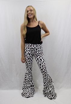 These leopard flared denim pants are sure to be a show stopping staple piece. Pair with our black ribbed tank for a stand out outfit!! Model is wearing a size small. Trendy Flares For Night Out In Fall, Casual Flare Jeans For Night Out, Trendy Wide Leg Flares For Night Out, Casual Black Flares For Night Out, Black Stretch Flare Jeans For Summer, Casual Wide Leg Flares For Night Out, Stretch Flares For Summer Night Out, Trendy Leopard Print Bottoms For Fall, Stretch Flare Jeans For Night Out