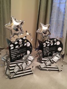 two star shaped trophies sitting on top of a table