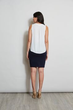 Luxurious Georgette elevates this minimalist top. Its split neckline and soft shoulder pleat detail add a touch of feminine flair. This essential piece will take you from Spring into Fall. T-Tahari Sleeveless Split Neck Georgette Shirt Relaxed Fit; Runs true to size. Model is 5'9" and wearing size S Imported Style #: THF41048 Flattering Sleeveless Tops, Viscose Tank Top For Workwear In Spring, Fitted Viscose Tank Top For Work, Sleek Sleeveless Top For Workwear, Sleek Sleeveless Blouse For Work, Versatile Sleeveless Top For Business Casual, Sleek Sleeveless Workwear Top, Sleek Sleeveless Tank Top For Work, Sleek Sleeveless Top For Work