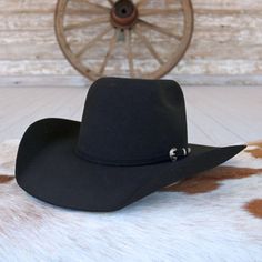 Introducing the Resistol Black 90 Pay Window cowboy hat, a timeless icon of Western heritage and style. Crafted from resilient black 3X wool with a round brick crown, it features a commanding 5 1/4" crown and a versatile 4 1/4" brim, ideal for any cowboy's daily adventures. Whether on the ranch or in the saddle, this hat is your ticket to classic cowboy charisma. 4 1/4" Brim 5 1/4" Crown Color: Black 3X Wool Black Felt Cowboy Hat, Felt Cowboy Hat, Black Cowboy Hat, Classic Cowboy, Felt Cowboy Hats, Black Cowboy, Black Felt, The Ranch, Cowboy Hat