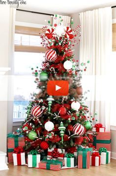 a christmas tree decorated with red, green and white ornaments