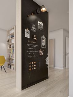 a room with a large black board on the wall