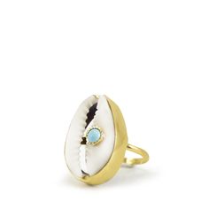 A reminder that sunny days are on the horizon, this ring is carefully handcrafted from 18k gold over silver featuring a cowry marked with a turquoise bead. Style it with its matching layered necklace from the Marina collection. Handmade from 18-karat Yellow Gold Over Sterling Silver (1 micron plating). We suggest to avoid contacts with soaps, detergents, chlorine and any other chemical substance that could alter the original characteristics of your jewel. When it is not worn, keep your jewelry p Handmade Open Ring Jewelry For Beach, Unique Gold Jewelry For Vacation, Unique Gemstone Jewelry For The Beach, Handmade Oval Jewelry For Beach, Unique Turquoise Jewelry For Vacation, Handmade Gold Rings For Beach, Handmade Gold Rings For The Beach, Blue Topaz Bracelet, Chunky Jewelry