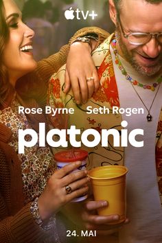 a man holding a cup next to a woman with her arm around him and the caption reads, rose byrne beth rogen platonic