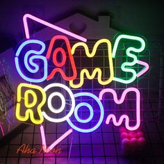 a neon sign that says game room on it