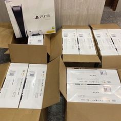 several boxes are stacked on top of each other in front of the playstation 5 console