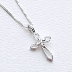 "Sterling Silver Cross Pendant Necklace, Woman's Christmas Cross Christian Gift, FREE SHIPPING, Open Work Cross, Dainty Crucifix, Religious Jewelry, Baptism, Confirmation, Christening This high polished 925 solid sterling silver pendant has an elegant open work design with a small floral accent centered on the cross. The cross pendant can be matched with your choice of eleven chain lengths and clasp combinations. ★Please note this pretty 925 sterling cross with inlay design is a dainty 15 mm in Cross Pendant Necklace Woman, Inlay Design, Cross Christian, Faith Necklace, Cross Gift, Sterling Silver Cross Necklace, Silver Gift Box, Sterling Silver Cross Pendant, Silver Cross Pendant