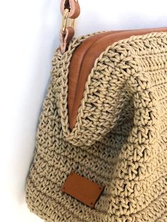 Stylish Handmade Crochet Bag for fashionable woman.  High quality metarials. Beige color cotton yarn  enriched with tan genuine leather. Can be used as a clutch or shoulder bag with adjustable handle. Perfect from day to night. Size : 27x18x10 cm Bag Mouth Size : 24 cm Adjustable handle :70cm-80cm Also perfect gift for your loved ones on special days, Mother's Day, Birthday, Valentine's Day, anniversary and graduations. Thank you for visiting our store! Handmade Beige Crossbody Bag, Handmade Everyday Rectangular Pouch, Beige Crochet Clutch Shoulder Bag, Crochet Clutch Bag For Everyday Use, Everyday Handmade Crochet Pouch Bag, Handmade Everyday Crochet Pouch Bag, Handmade Crochet Pouch Bag For Everyday Use, Handmade Beige Crossbody Shoulder Bag, Handmade Natural Color Clutch Bag