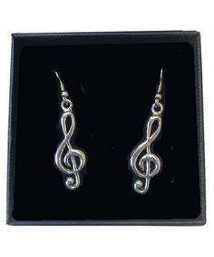 These treble clef earrings are beautifully handcrafted and incredibly detailed in fine English pewter. Would make a great addition to that musical wardrobe! ♫ Handmade in England. ♫ Presented in a beautiful gift box. �♫ English pewter . ♫ 1 1/4" H x 1/2" W Music-themed Metal Jewelry For Gifts, Adjustable Metal Music-themed Jewelry, Silver Nickel-free Music-themed Earrings, Music-themed Silver Earrings, Silver Music-themed Jewelry For Party, Music-themed Silver Jewelry For Parties, Music-themed Dangle Jewelry Gift, Silver Music-themed Metal Jewelry, Music-themed Silver Metal Jewelry