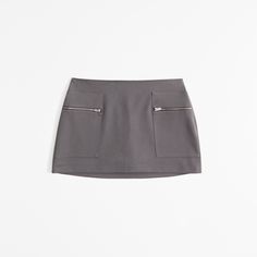 Elevate your wardrobe with the Abercrombie & Fitch Women's Mid Rise Zip Mini Skort, a perfect blend of style and practicality. This chic dark gray skort combines the elegance of a skirt with the comfort of shorts, making it an ideal choice for both casual outings and stylish events.

- Size: XL
- Color: Dark Gray
- Material: Body: Polyester, Lining: Polyester
- Gender: Female
- Features: Mid-rise, front pockets with zipper closure, elasticated waistband for a secure fit

Crafted with a soft poly Solid Color Mini Shorts With Pockets, Fitted Short Length Skort With Zipper Closure, Workwear Mini Skirt With Zip Fly, Spring Skort With Zipper Closure, Casual Mini Skort With Zipper Closure, Workwear Short Skort With Pockets, Casual Mini Bottoms With Zipper Closure, Casual Skort With Zipper Closure For Spring, Casual Spring Skort With Zipper Closure