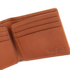 Improved classic design Embossed full grain vegetable tanned premium leather RFID - protected 3.3"H x 4.1"W x 0.5"D (folded) Holds 6 – 12 cards 2 slip pockets Flat bill section Fabric lining Branded gift box Imported Classic Cognac Bifold Card Holder, Classic Cognac Trifold Wallet With Coin Pocket, Classic Cognac Wallets With Smooth Grain, Classic Cognac Wallet With Smooth Grain, Classic Brown Trifold Wallet With Leather Lining, Classic Trifold Leather Wallet In Cognac, Classic Leather Trifold Wallet In Cognac, Classic Cognac Leather Trifold Wallet, Cognac Bifold Wallet With Smooth Grain