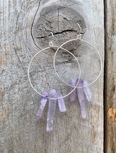 Raw purple quartz crystal points in gold or silver hoop earrings with French hooks. Perfect little boho look. Light weight and easy to wear. Add these to your boho outfits and make a 💜Healing clear quartz Crystal property has been know for centuries to restore balance in the body. -Options- 30mm as shown 21 gauge hoops Total drop Length: 2.3 inches 14k Gold filled hoops Sterling silver hoops Gold plated hoops Silver plated hoops All comes with hooks Simple, Dainty, Delicate, yet so Elegant and Adjustable Gemstone Hoop Jewelry, Bohemian Sterling Silver Wire Wrapped Hoop Earrings, Nickel-free Purple Dangle Hoop Earrings, Purple Nickel-free Dangle Hoop Earrings, Purple Bohemian Everyday Jewelry, Purple Dangle Hoop Earrings With Ear Wire, Bohemian Wire Wrapped Hoop Crystal Earrings, Bohemian Small Hoop Jewelry With Natural Stones, Bohemian Hoop Jewelry With Natural Stones