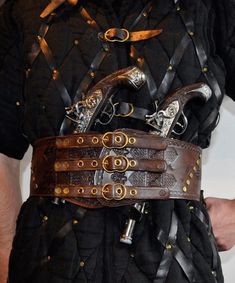 A belt, perfect for cosplay. Viking or pirate style. Buckles are hand forged from brass. Belt has 2 metal rings to hang additional equipment. Pistols are not included.  Size: Standard Length:  From 87,5 cm  (34,45 inches) to 97,5 cm (38,39 inches) - can be customized Width: - narrowest: 10,1 cm (3,98 inches) - widest: 13,3 cm (5,24 inches) Skin thickness: 3 mm (0,12 inches) - 4 mm (0.15 inches)  I can customize the size of the belt. If you want to, please select the "CUSTOM SIZE" option and writ Pirate Knife Belt, Leather Barbarian Belt, Leather Viking Costume, Leather Adventure Belt, Fantasy Belt Leather, Medieval Accessories Modern, Archer Costume, Elven Wedding Dress, Cosplay Style