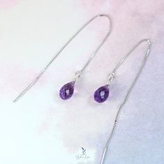 These minimalist elegant purple Amethyst teardrop ear threaders feature a beautiful faceted teardrop shape Amethyst natural stone on 925 sterling silver box chain threaders. Add these elegant purple teardrop Amethyst ear threader earrings to your everyday fine jewelry collection or as a gift for your loved one. Amethyst is a protective stone, it relieves physical and psychological pain or stress. Amethyst is one of the most spiritual stones, encouraging selflessness and spiritual wisdom. Amethyst is February birthstone, these Amethyst teardrop earrings are perfect for February born's people gift. Materials: 925 sterling silver, natural Amethyst Jewelry Care: See more information about how to care for your jewelry here. Shipping Policy: Orders will be shipped within 1-3 business days. Econo Ear Threader, Amethyst Healing, Amethyst Jewelry, Spiritual Wisdom, February Birthstone, Silver Box, Threader Earrings, Fine Jewelry Collection, February Birth Stone