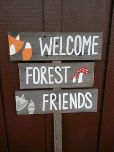 a wooden sign that says welcome forest friends