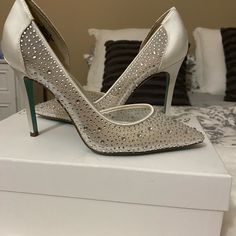 Bought For My Wedding Last Year And Never Ended Up Wearing Them! Brand New In The Box! Very Cute And Not Too High Of A Heel! The Box Describes Them As Ivory But They Are More Of A Light Silver/White. They Are Satin On The Heel And Back And Then A Mesh With Rhinestones On The Tops And Sides. The Bottom Of The Heels Are A Tiffany Blue That Betsey Uses For Her Bridal Style Shoes! Rhinestone Synthetic Heels For Wedding, Wedding Heels With Rhinestones In Synthetic Material, White Synthetic Wedding Shoes, Glamorous Synthetic Wedding Shoes, Betsey Johnson Shoes, Tiffany Blue, Bridal Style, Betsey Johnson, Shoes Women Heels