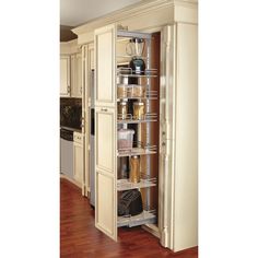 a tall cabinet in the middle of a kitchen with lots of cupboard space and shelves