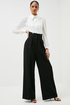 {@@=Ist.Core.Helpers.StringHelper.ToProperCase("Experience elevated tailoring in a pair of tall wide leg trousers, featuring a flattering, relaxed fit and a comfortable high waistline adorned with corset detailing. The sleek design makes them easy to style with anything, from a button up shirt and the matching blazer for a formal look, or with a T-shirt and trainers for a more laid back approach. Tall Tailored Compact Stretch Corset Waist Wide Leg Trousers High Quality Stretch Fabric Unique Cors Womens Suit Trousers, Ethereal Dramatic, High Waist Dress Pants, High Waist Wide Leg Trousers, Petite Wedding Guest Dresses, Plus Size Workwear, High Waisted Dress Pants, Dramatic Classic, Black Wide Leg Trousers