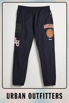 Lincoln University UO Exclusive woven jogger sweatpants from our limited-edition Lincoln University merch collection. Warm-up joggers in a regular fit with a pull-on waist and Lincoln University patch detailing at the legs. Finished with side and back pockets and two zip pockets. Lincoln University is the nation’s first degree-granting HBCU, and with this exclusive merch drop, UO has committed to a donation to the school. Find them only at Urban Outfitters. Features Lincoln University UO Exclusi Navy Athleisure Joggers For Streetwear, Sports Joggers With Logo Detail And Relaxed Fit, Relaxed Fit Sports Joggers With Logo Detail, Navy Sweatpants For Streetwear, Navy Relaxed Fit Joggers For Streetwear, Sporty Graphic Print Joggers For Sports, Navy Sporty Joggers For Streetwear, Sporty Pants With Graphic Print For Sports, Athleisure Bottoms With Embroidered Logo For Streetwear