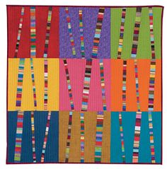 a multicolored patchwork quilt with vertical strips