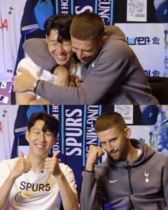 two men are hugging each other in front of a wall with sports logos on it