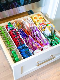 a drawer filled with lots of different types of candy and confection in it