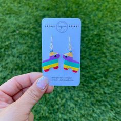 You wear the party on your ears with our Burro Piñata Dangle Earrings and Studs.  Our pinata earrings would make a great one of a kind gift, or a cute addition to an outfit.   Each earring is handmade and completely unique. If you're interested, you can see my process from beginning to end on my Tiktok @sirenamaxx. My earrings are made of 1/8 of an inch thick light weight polymer clay and are finished with a surgical steel, nickel-free ear wire and ear posts. Dangle Earrings hang 1 inch from ear Novelty Multicolor Dangle Jewelry, Multicolor Novelty Dangle Jewelry, Novelty Multicolor Earrings For Birthday, Nickel-free Multicolor Novelty Jewelry, Novelty Multicolor Earrings With Ear Wire, Multicolor Novelty Earrings, Nickel-free Multicolor Earrings For Birthday, Playful Multicolor Earrings For Birthday, Colorful Fun Dangle Earrings