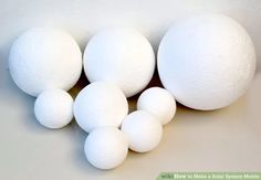 five white balls are lined up in a row