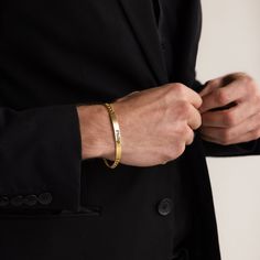 Give the gift of sentiment with the Men's Signature Engraved Bar Bracelet. A fully customizable bar sits along an extra bold and thick curb chain and a loop closure made just for him. A great way to say Happy Father’s Day, or just a simple ‘Thinking of you’ gesture. Material: High Quality Solid 925 Sterling Silver Finish: Sterling Silver ∙ 18K Gold ∙ Rose Gold Featuring Engravable Bar Bracelet with thick Cuban Link Chain Model showcases a timeless, bold bracelet featuring our Black Signet Ring. Modern Engraved Bangle For Anniversary, Modern 14k Gold Name Bracelet For Formal Occasions, Modern Jubilee Name Bracelet For Formal Occasions, Elegant Customizable Bracelet, Classic Bracelets For Everyday And Father's Day, Classic Everyday Bracelets For Father's Day, Minimalist Engraved Bracelets For Formal Occasions, Elegant Formal Bracelet Wristband, Classic Customizable Yellow Gold Bracelet