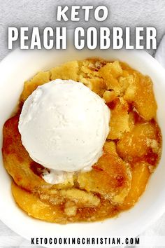 a close up of a bowl of food with ice cream on top and the words keto peach cobbler above it