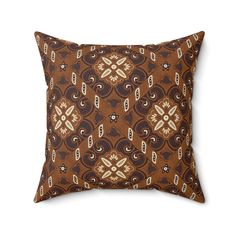 a brown pillow with an intricate design on it