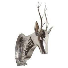 a metal deer head with antlers on it's back and its mouth open