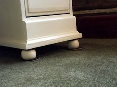 a small white stove sitting on top of a floor