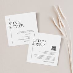 two white business cards sitting on top of each other next to some dried flowers and twigs