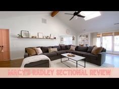 a living room filled with furniture and a ceiling fan