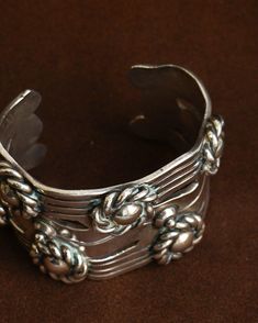 Sterling silver Approx. 2.5" inside, 1.5" open Spratling described this stunning design as "a wide Aztec bracelet with framed buttons" according to Goddard's spratlingsilver.com. It was one of Spratling's most popular designs in the 1930's - 1940's and still is today. Unique Ceremonial Sterling Silver Cuff Bracelet, Handmade Silver Cuff Jewelry, Silver Collectible Cuff Bracelet, Collectible Silver Cuff Bracelets, Collectible Silver Cuff Bracelet, Silver Heirloom Wide Band Jewelry, Vintage Handmade Wide Band Jewelry, Handmade Vintage Wide Band Jewelry, Vintage Sterling Silver Cuff Bangle