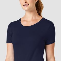 The comfortable and luxurious feel of the Wink Silky Short Sleeve Tee makes it a must-have layering piece. This modern tee is crafted in unbelievably soft rayon and spandex with an even longer, sleeker length for added coverage. Available in vibrant, trendy colors, the short sleeve tee pairs very well with Wink scrubs and is good for all occasions, from work to casual wear. Fitted Basic Tops For Loungewear, Seamless Tops With Relaxed Fit, Seamless Short Sleeve Tops For Layering, Solid Color Seamless Tops With Relaxed Fit, Stretch Scoop Neck T-shirt For Layering, Classic Fitted Tops For Loungewear, Classic Stretch T-shirt For Layering, Fitted Scoop Neck T-shirt For Layering, Fitted Casual Short Sleeve Top For Layering