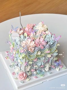 there is a cake that looks like it has many flowers on the top and sides