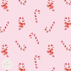 candy canes and bows on a pink background