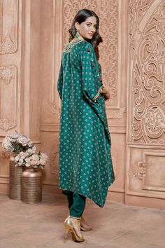 Green kaftan style kurta with geometric prints and hand embroidered yoke and sleeve hem. Comes with tulip pant.
Component: 2
Pattern: Printed, Hand Embroidered
Type Of Work: Geometric and Floral Pattern
Neckline: V-Neck
Sleeve Type: Draped Sleeves
Fabric: Tussar Georgette
Color: Green
Other Details: 
Tassel sleeve details
Lace hem tulip pant and kurta
Occasion: Mehendi and Haldi - Aza Fashions Green Kaftan, Tulip Pants, Draped Sleeves, Kaftan Style, Geometric Prints, Drape Sleeves, Lace Hem, Fashion App, Pant Set