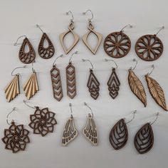 Included in this listing are 10 finely crafted wood earrings and 1 free mystery earring.These wood earrings are made from birch wood. They are lightweight and ideal for daily wearing. Great for those with sensitive ears.Ear wires are made from surgical stainless steel (nickel free).Wood measurements average approximately 1.5” tallThe items ordered comes in cute gift bags. Items shown in the gift bag in the photo are for illustrative purposes.Free shipping for US customers!Every piece of wood is Cnc Jewellery Design, Handmade Wood Earrings, Cute Gift Bags, Cut Crafts, Cricut Earrings, Glowforge Ideas, Glowforge Projects, Engraving Projects, Cork Earrings