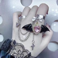 This Gothic Punk Angel Wings Bowknot Cross Ring is the perfect addition to add an edgy touch to any outfit. Multi-layers of cross and wings accents, coupled with bowknot detailing give this ring a truly unique look. Dare to make a statement with this fashionable yet unique ring! Edgy Adjustable Rings For Halloween, Adjustable Edgy Halloween Rings, Edgy Halloween Rings For Gift, Alternative Metal Jewelry For Cosplay, Edgy Metal Rings For Halloween, Punk Alloy Jewelry For Halloween, Grunge Style Rings For Halloween Gift, Silver Alternative Jewelry For Cosplay, Silver Harajuku Jewelry For Party